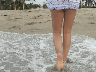 Sexy legs, sand and sea