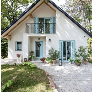 A small house with a veranda and a garden is my dream