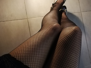 Sexy legs in fishnet stockings
